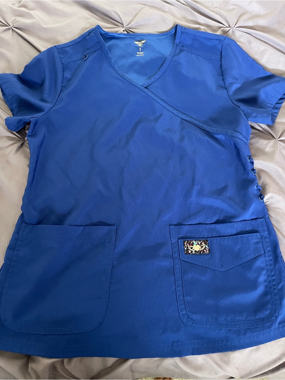koi Royal Blue Scrub Top with Colorful Logo Patch